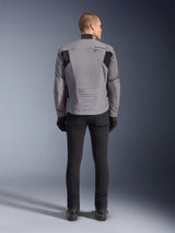 Alpinestars SMX Waterproof Jacket, Rear view, Dark Gray and Black, featuring black textile panels on shoulders and a sport-fit design, paired with black pants and gloves for a complete motorcycling look
