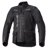 Alpinestars Bogota Pro Drystar Jacket, All-Black Motorcycle Touring Jacket, Gray and Red accents, featuring large chest ventilation panels, waterproof pockets with red pull tabs, high protective collar, and durable textile construction for adventure riding.