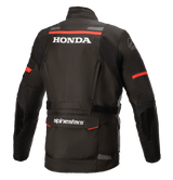 Alpinestars Honda Andes V3 Drystar® Jacket, Black, rear view featuring white Honda and Alpinestars branding, red accent stripes on the shoulders and sleeves, adventure touring motorcycle jacket with reflective details and a large rear utility pocket.
