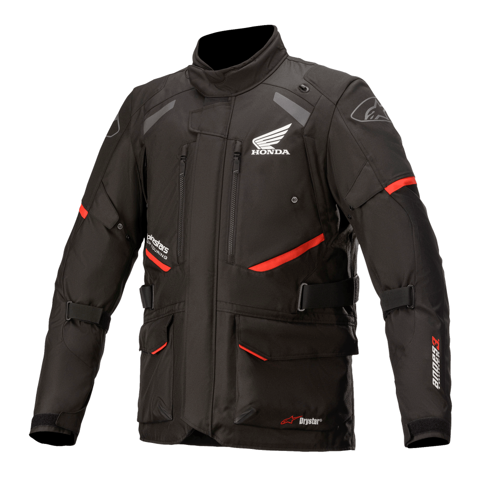 Honda Andes V3 Drystar Jacket, Motorcycle Touring Jacket, Black with Red Accents, front view featuring large cargo pockets and adjustable straps, technical textile construction with Honda wing and Alpinestars logos, adventure-inspired design