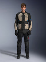 Model wearing Alpinestars Andes Air Drystar® Jacket, Motorcycle Touring Jacket, Black Laurel Gray and Bright Blue, paired with matching black riding pants and gloves, featuring extensive mesh ventilation panels on the chest and sleeves for warm-weather adventure touring.