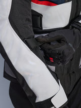 Alpinestars Andes Air Drystar® Jacket in Deep Blue Black Ice Gray, close-up view of the adjustable sleeve strap and mesh ventilation panels, featuring durable textile construction for adventure touring