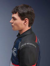 Alpinestars Andes Air Drystar® Jacket, Deep Blue Black Ice Gray colorway, side profile of a male model wearing the mesh textile jacket, featuring Alpinestars branding on the shoulder and red accents, dual-season touring gear