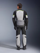 Alpinestars Andes Air Drystar® Jacket and Pants, Ice Gray Dark Gray Black adventure touring kit, rear view of rider wearing complete gear with neon yellow accents, featuring large mesh ventilation panels and Alpinestars branding.
