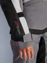 Alpinestars Stella Andes v4 Drystar® Jacket, Women's Motorcycle Jacket, Dark Gray Ice Gray and Black, close-up of sleeve showing Drystar® logo and velcro wrist closure on reinforced textile panel