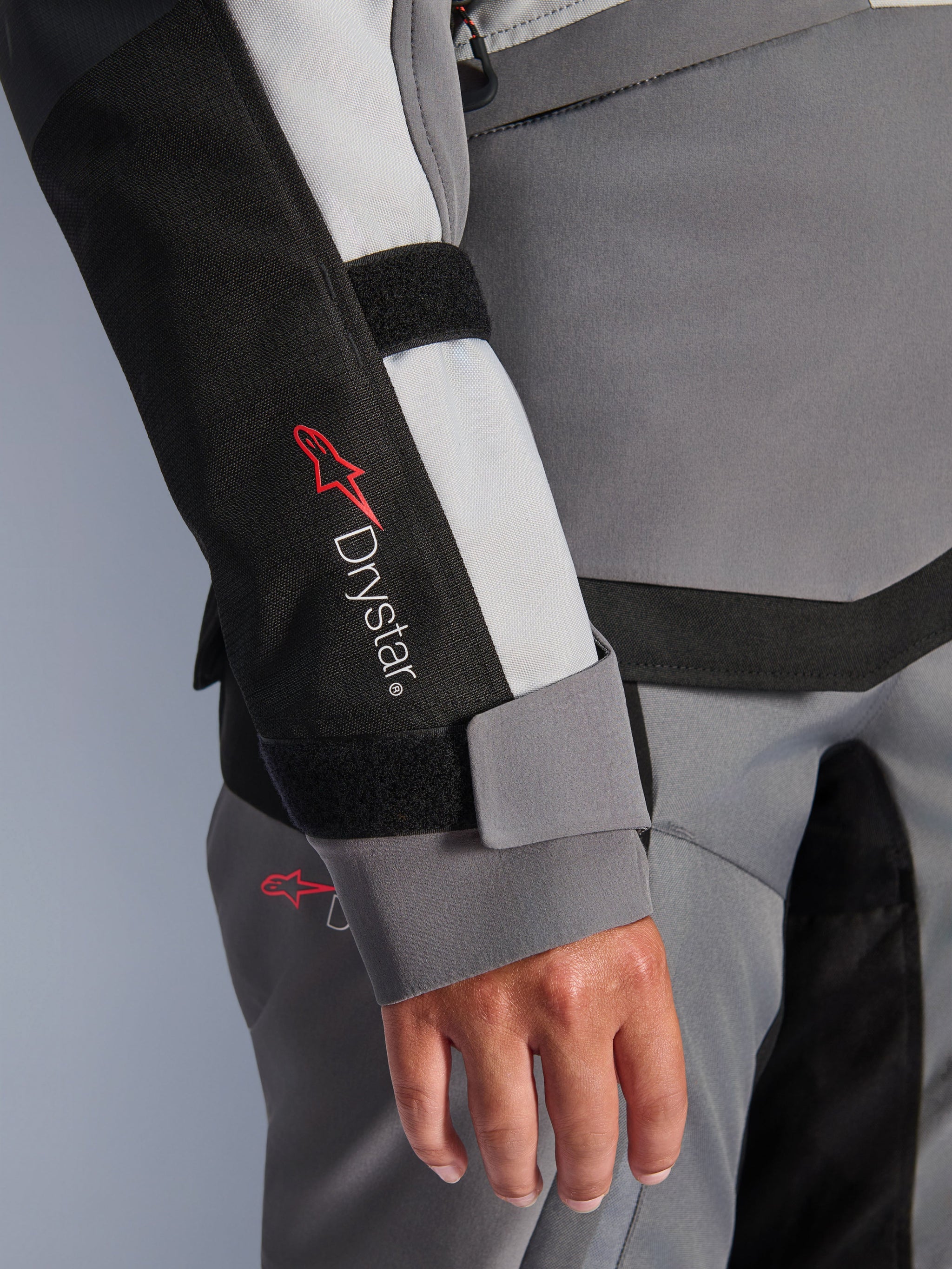 Alpinestars Stella Andes v4 Drystar® Jacket, Women's Motorcycle Jacket, Dark Gray Ice Gray and Black, close-up of sleeve showing Drystar® logo and velcro wrist closure on reinforced textile panel
