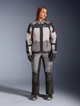 Alpinestars Stella Andes V4 Drystar® Jacket, Women's Adventure Motorcycle Jacket, Dark Gray Ice Gray and Black with Coral Fluo accents, worn as a complete suit with matching pants and gloves, front full-body view