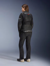 Alpinestars Stella Andes Air Drystar® Jacket, Women's Motorcycle Touring Jacket, Black, back view worn with matching riding pants and boots, featuring large mesh ventilation panels, a red star logo, and silver Alpinestars branding on the lower back.