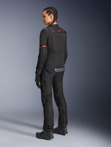 Alpinestars Stella ST-2 Air Jacket, Women’s Motorcycle Jacket, Black with red accents on sleeves and upper back, rear view on model wearing matching black motorcycle pants and boots, featuring reflective Alpinestars branding and modern textile construction.