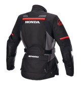 Alpinestars Women Stella Honda Andes V3 Drystar® Jacket, Motorcycle Adventure Jacket, Black Tar Gray and Bright Red, Rear view featuring bold white HONDA logo and red Alpinestars graphics, waterproof textile construction with adjustable waist and utility pockets