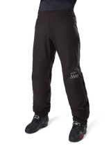 Alpinestars Amt-8 Stretch Drystar® XF Pant Liner, Black, waterproof and stretchable textile construction with silver AMT logo, worn with black riding boots, adventure touring motorcycle gear component.