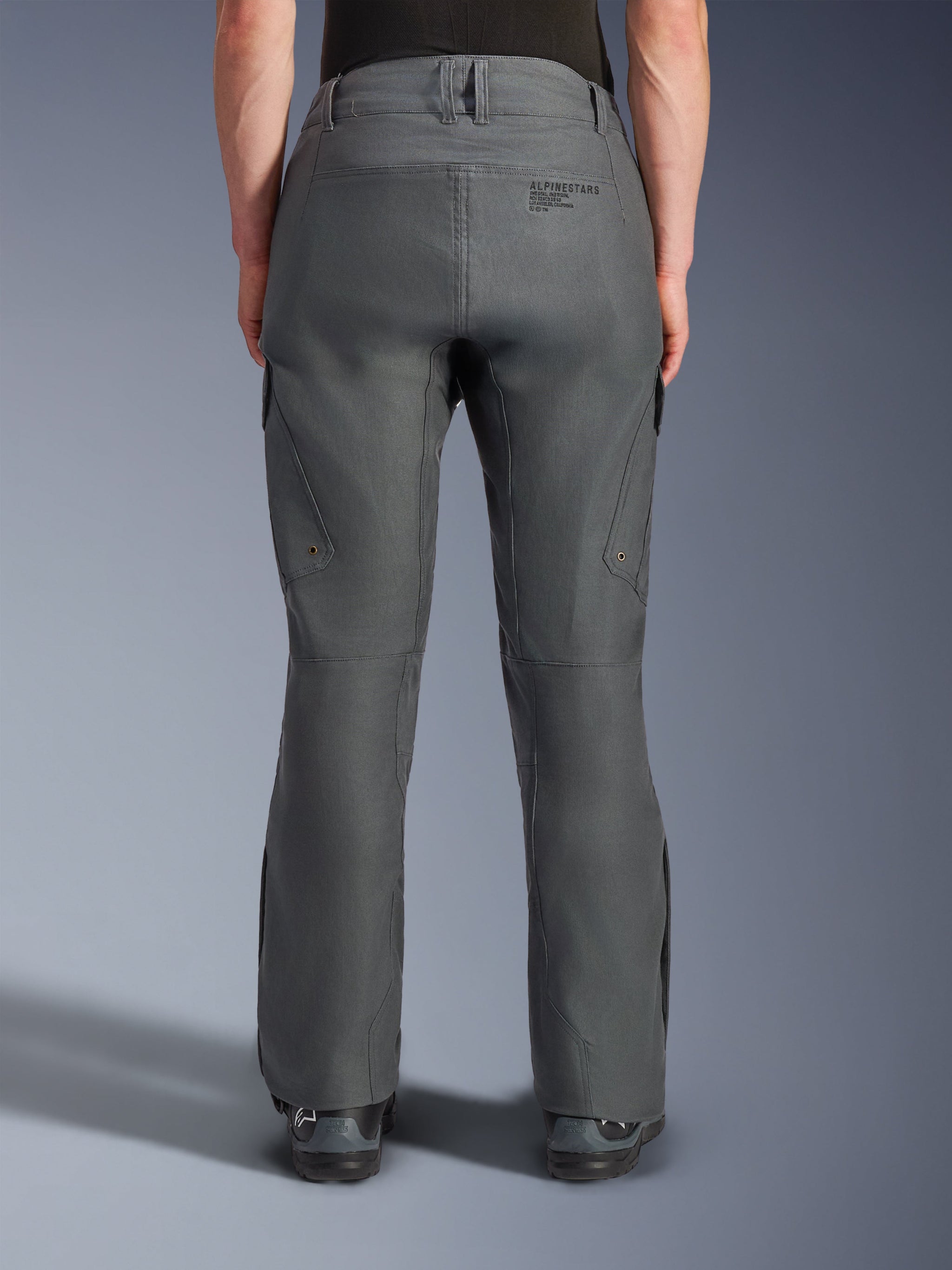 Alpinestars Borrego Drystar® Pants, Adventure Motorcycle Pants, Gray Anthracite, rear view showing textile construction with a waxed-canvas appearance, features Alpinestars branding on the back, cargo pockets, and belt loops, durable and rugged design for adventure riding
