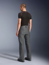 Alpinestars Borrego Drystar® Pants, Adventure Motorcycle Pants, Anthracite Gray, rear view, featuring a waxed-canvas look with cargo pockets, paired with a black t-shirt and riding boots, durable design for road and adventure touring
