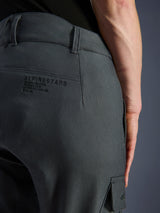 Alpinestars Borrego Drystar® Pants, Motorcycle Pants, Anthracite Gray, close-up of the back hip area featuring Alpinestars branding and slogan, durable textile with a waxed-canvas look, adventure riding apparel