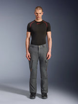 Alpinestars Borrego Drystar® Pants, Gray Adventure Motorcycle Pants, worn by a model with a black and red technical t-shirt and black boots, featuring cargo pockets with vertical zippers, rugged waxed-canvas appearance, durable design for adventure touring and road riding