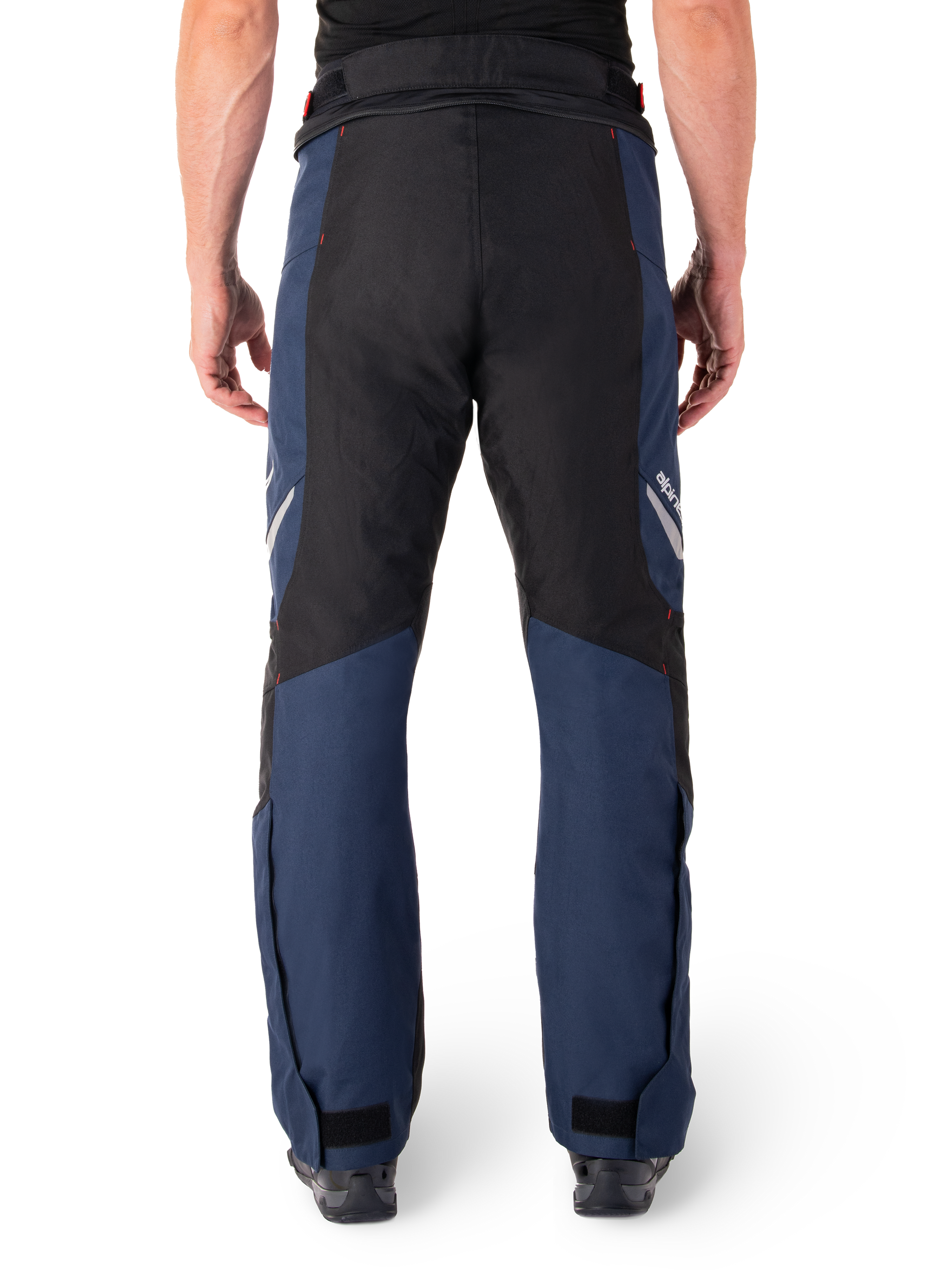 Alpinestars St-1 Waterproof Pants, Motorcycle Touring Pants, Dark Blue and Black with Bright Red accents, rear view, streamlined touring design featuring durable textile construction, reflective branding, and adjustable ankle closures.