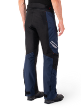Alpinestars St-1 Waterproof Pants, Dark Blue Black and Bright Red, rear view showing black contrast panels, reflective Alpinestars logo on the side thigh, and ergonomic fit for motorcycle touring