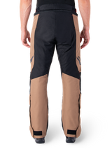 Alpinestars St-1 Waterproof Pants, Motorcycle Touring Pants, Dark Khaki Sand and Black with Red Fluo accents, rear view, featuring a durable textile construction, ergonomic panels for mobility, and adjustable hook and loop ankle closures.