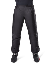 Alpinestars Bogota Pro Drystar 3 Seasons Pants, Waterproof Motorcycle Pants, Black, lightweight technical fabric with reflective knee patches, worn as over-pants with black riding boots, designed for adventure touring weather protection