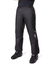 Alpinestars Bogotá Pro Drystar® 3 Seasons Pants, Adventure Touring Motorcycle Pants, Black, worn with black riding boots, featuring reflective patches on the knees and Drystar branding, lightweight waterproof textile design for all-season riding.