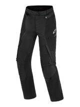 Alpinestars Stella Andes V4 Drystar® Pants, Women's Adventure Motorcycle Pants, Black, front view showing technical textile construction, white Alpinestars logo on the left thigh, cargo pockets, and ventilation zippers, durable all-weather riding gear