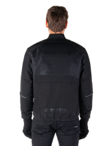 Alpinestars Mootant Waterproof Parka, Black Motorcycle Jacket, Rear view showing mesh upper for airflow and MO.ST.EQ. reflective logo on the lower back, modular 4-season gear