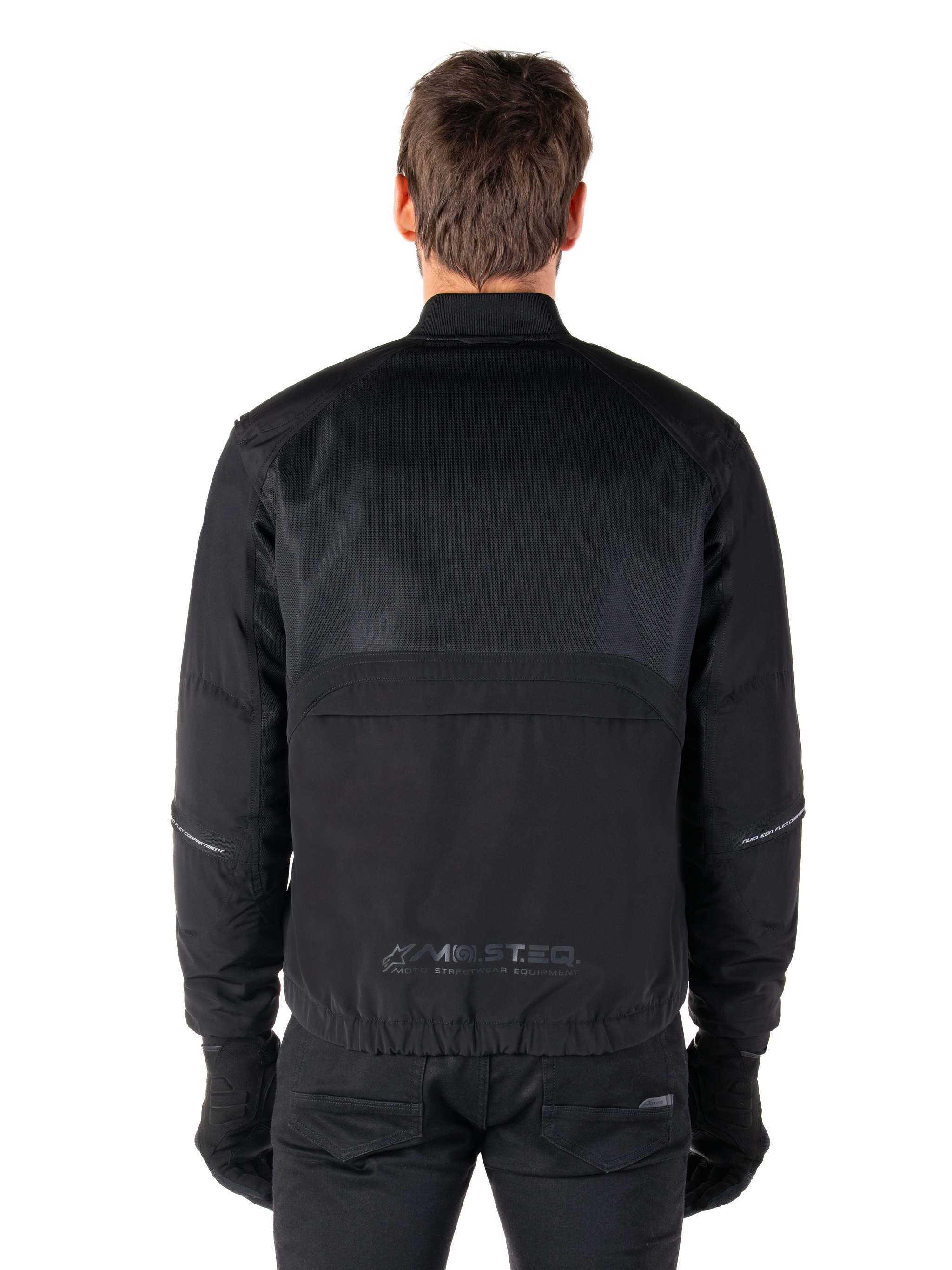 Alpinestars Mootant Waterproof Parka, Black Motorcycle Jacket, Rear view showing mesh upper for airflow and MO.ST.EQ. reflective logo on the lower back, modular 4-season gear
