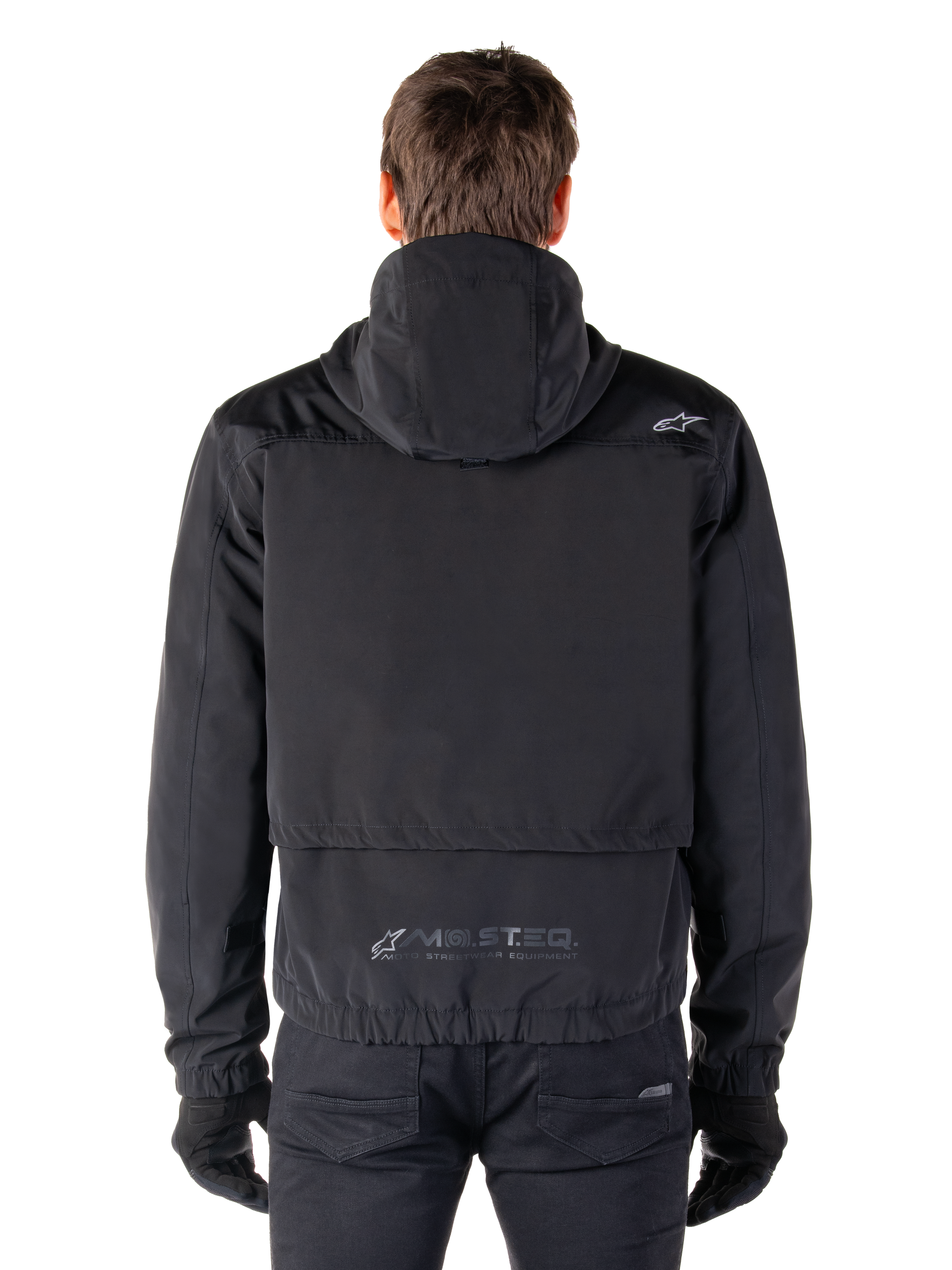 Alpinestars Mootant Waterproof Parka, Black Motorcycle Jacket, rear view showing hooded design, featuring small Astar logo on the shoulder and MO.ST.EQ. reflective branding on the lower back