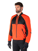Alpinestars Mootant Waterproof Parka in Spicy Orange and Black, modular motorcycle jacket shown in its bomber configuration, features black mesh and orange textile panels, urban contemporary riding gear worn with black gloves