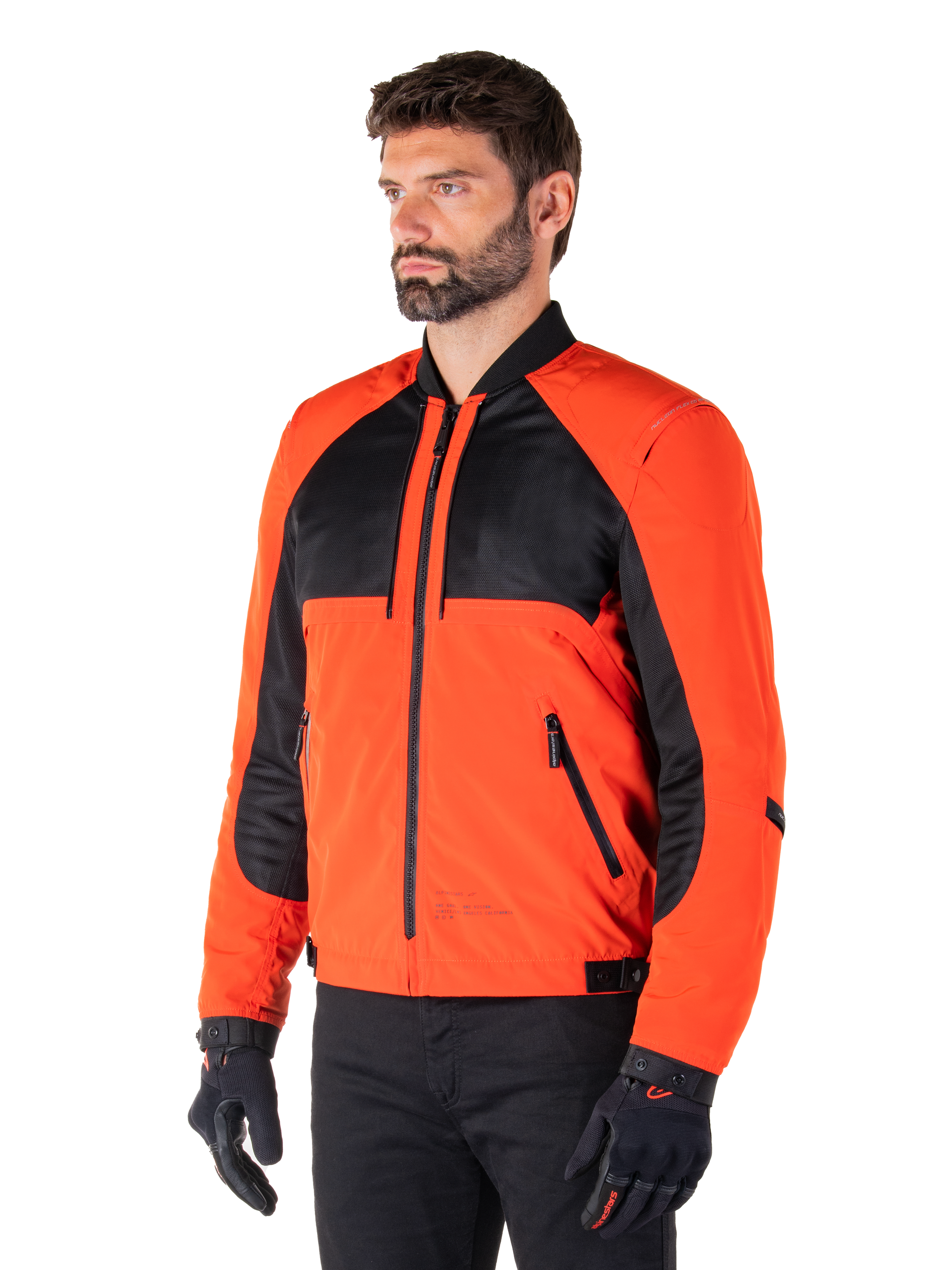 Alpinestars Mootant Waterproof Parka in Spicy Orange and Black, modular motorcycle jacket shown in its bomber configuration, features black mesh and orange textile panels, urban contemporary riding gear worn with black gloves