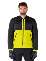 Mootant Waterproof Parka, modular motorcycle jacket, Lime Punch and Black, worn by a male model with black gloves and pants, featuring a vibrant yellow lower body and black upper torso and sleeves, utilitarian design for all-weather riding