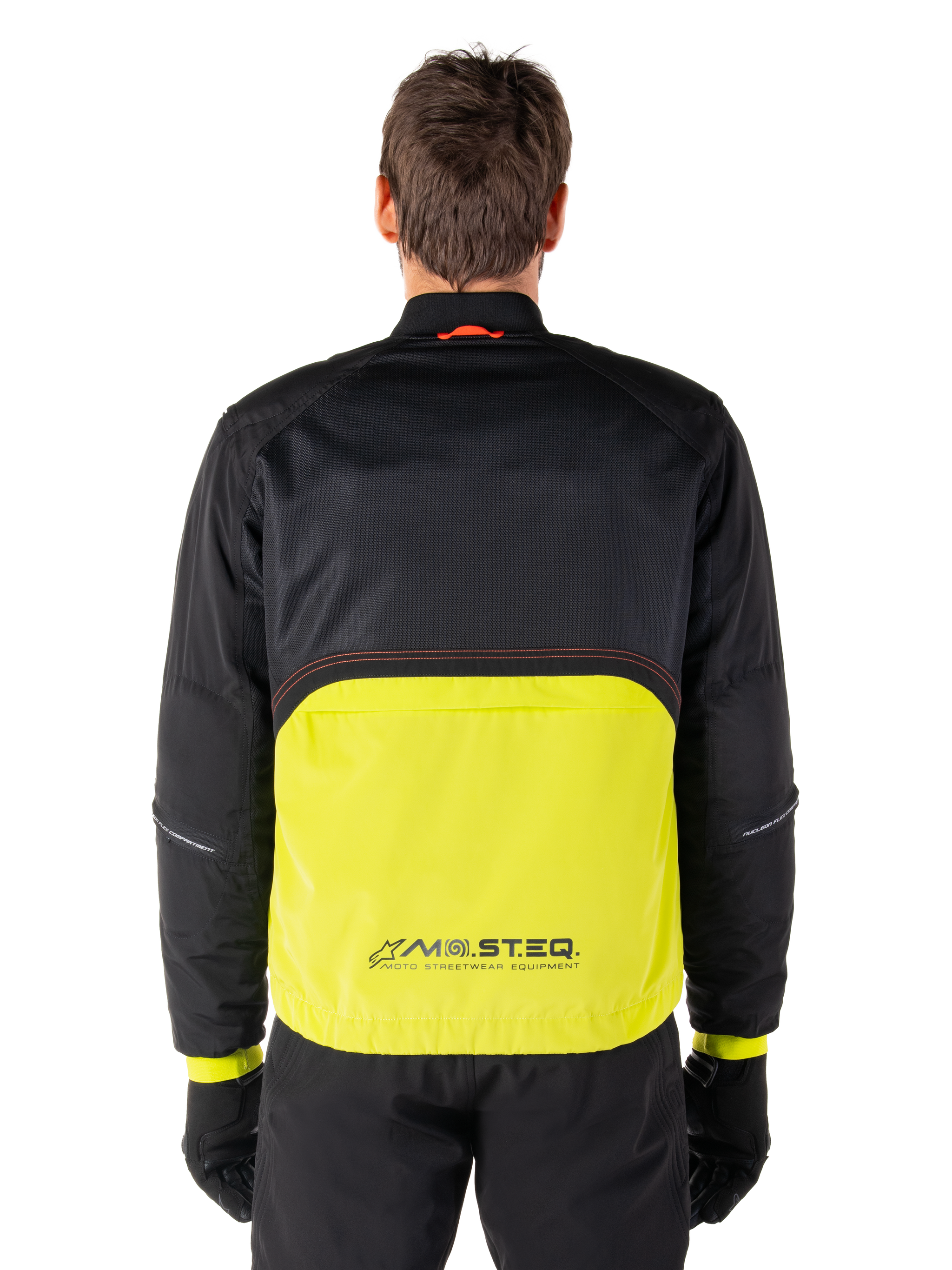 Alpinestars Mootant Waterproof Parka, Motorcycle Jacket, Lime Punch and Black, back view featuring black mesh upper for ventilation and lime lower section with MO.ST.EQ. logo, worn with black pants and gloves