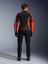 Alpinestars Viper Air V4 Jacket, Red Fluo and Black, back view showing large tech mesh panels and bright red fluorescent side accents, red Alpinestars logo on the lower back, worn with black riding pants and gloves.