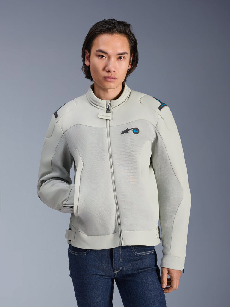 Alpinestars Circal-1 Air Jacket, Metal Gray and Methyl Blue, urban motorcycle jacket with mesh airflow panels, zip front and padded collar, worn by a model with blue jeans, futuristic sustainable design for summer riding