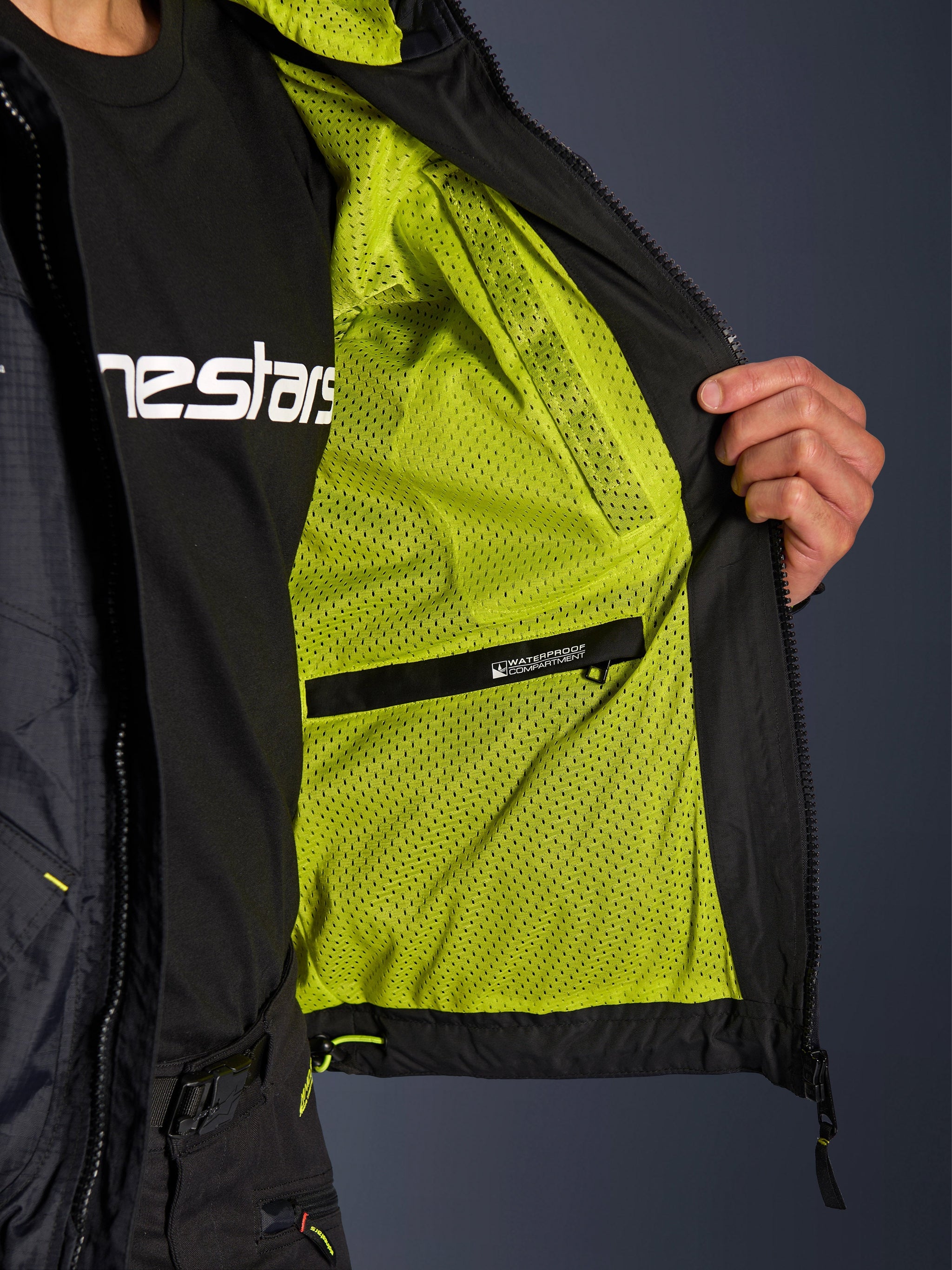 Alpinestars Mogress Air Jacket, men's black urban motorcycle jacket with lime punch mesh lining and waterproof inner pocket.