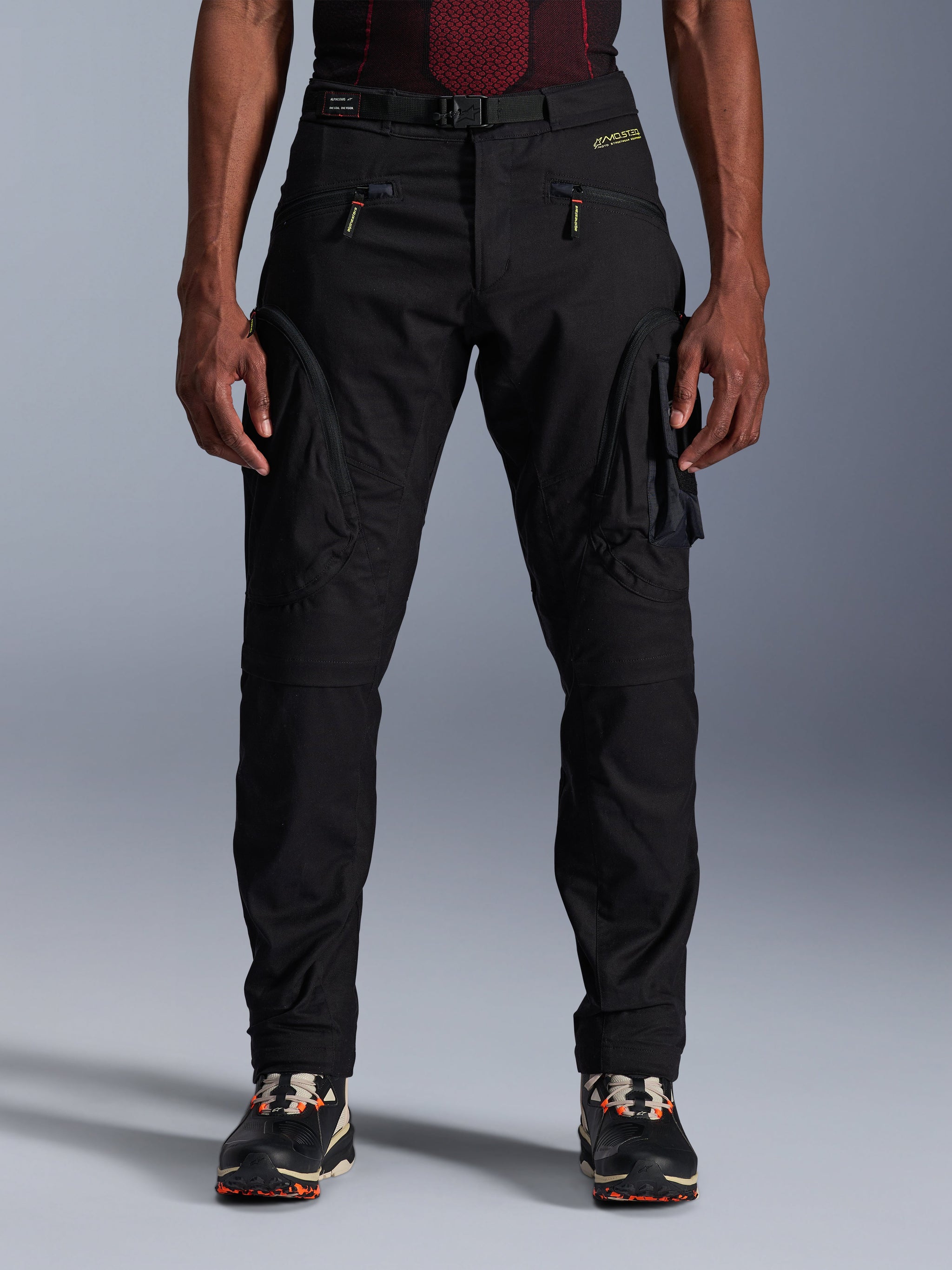 Alpinestars Acteon Pants, Black Urban Motorcycle Pants, tapered regular fit featuring side cargo pockets with reverse coil zippers, integrated waist belt and yellow branding, protective textile riding gear