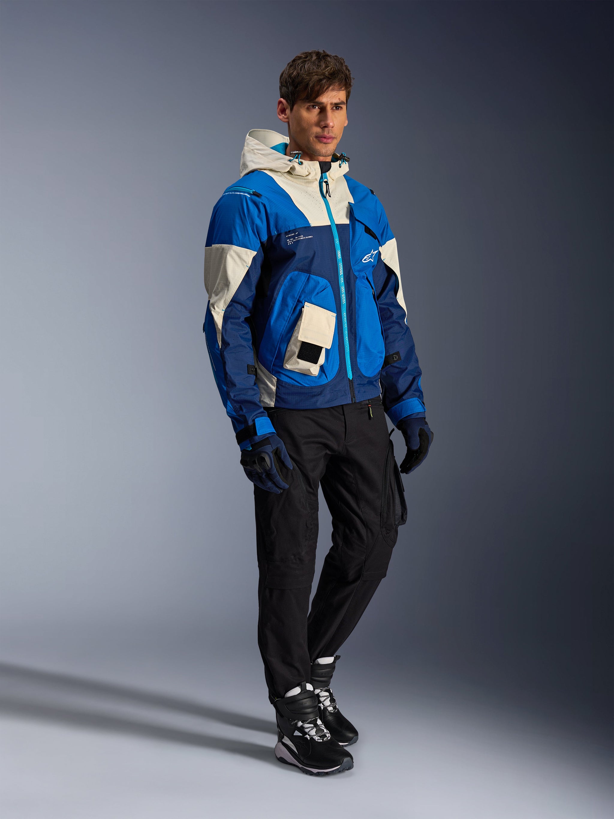 Alpinestars Mogress Air Jacket in Blue Almond, a men's textile urban motorcycle jacket with a hood and utility pockets.