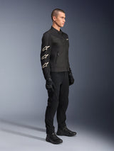 Alpinestars T-Dyno Air Jacket, Black, textile motorcycle jacket, featuring three white Alpinestars logos on the sleeve, worn with matching black pants and gloves, urban riding gear with breathable mesh panels