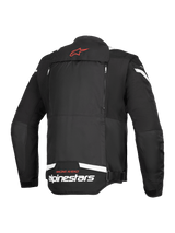 Alpinestars T-Stunt Air Jacket, Rear View, Black and White, featuring a red star logo on the neck, white branding at the lower back, and vertical zippers for the modular airflow system.