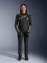 Alpinestars Stella T-Sps Air V2 Jacket, Women's Motorcycle Jacket, Black and White, featuring mesh panels and white accents, worn with black pants, gloves, and boots, athletic fit for urban riding