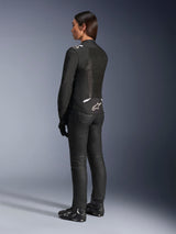 Alpinestars Stella T-Sps Air V2 Jacket, Black and White, back view showing mesh panels and logo on the lower back, paired with black riding pants and motorcycle shoes, sporty textile road gear for women