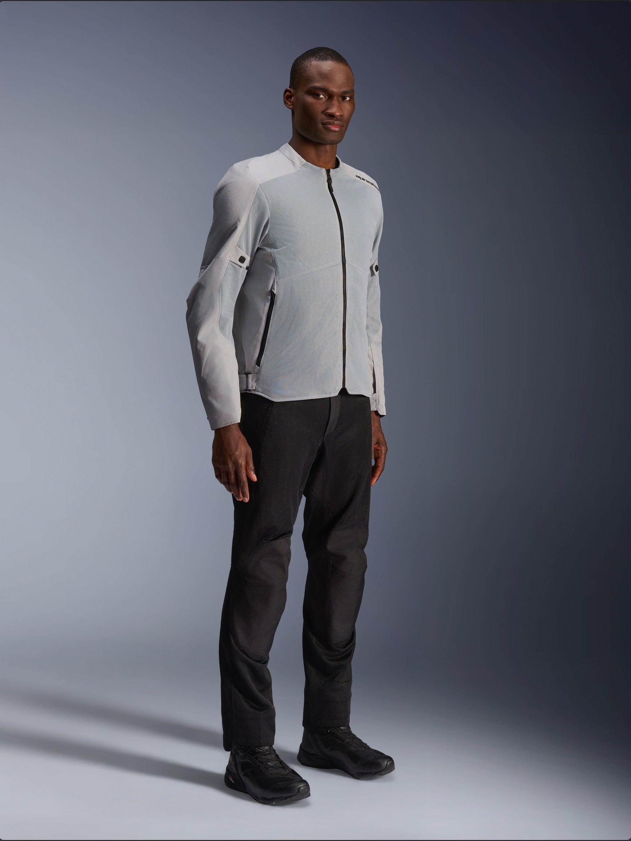 Alpinestars C-1 Air Jacket in Silver and Gray, Urban Motorcycle Jacket, lightweight textile and mesh construction, worn with black riding pants and black footwear, clean contemporary design for city riding