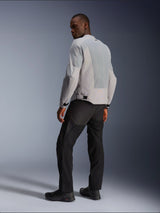 Alpinestars C-1 Air Jacket, Silver and Gray, viewed from the back on a model, featuring ventilated tech mesh panels and reflective logos, worn with black pants and shoes, urban contemporary motorcycle riding gear.