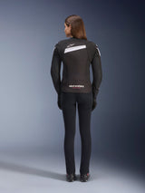 Alpinestars Stella T-GP Plus R V4 Jacket, Women's Textile Motorcycle Jacket, Black and White, rear view showing white accents and logo branding on the back, worn with black pants, sleek sport fit for road performance