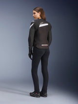 Alpinestars Stella T-GP Plus R V4 Jacket, Women's Textile Motorcycle Jacket, Black and White, back view on model, featuring white shoulder accents and Alpinestars logo, worn with black pants and riding gloves, sport-fit design for road riding