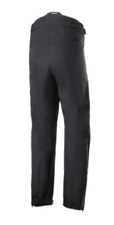 Alpinestars AMT Storm Gear Drystar® XF Pant, Black Motorcycle Overtrousers, rear view featuring a full circumference zippered waist connector, elasticated hems, and zippered leg openings for wet weather riding.
