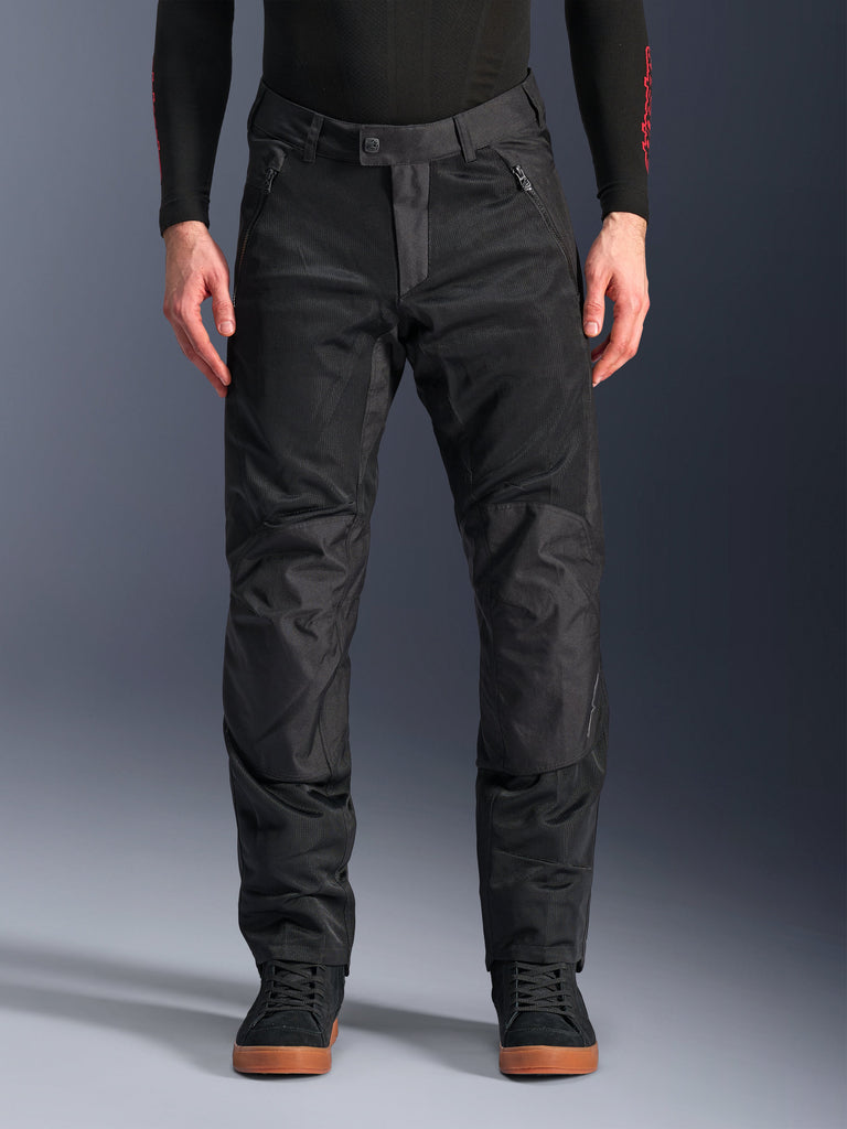 Alpinestars C-1 Air Pants, Black Textile Motorcycle Pants, urban riding gear featuring extensive mesh panels for airflow, reinforced knee sections, zippered front pockets, and a clean tailored fit.