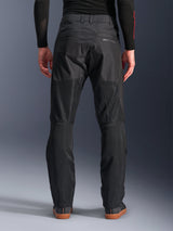 Alpinestars C-1 Air Pants, back view, Black, urban textile motorcycle pants featuring large tech mesh panels on the back of the legs for ventilation, clean design with subtle branding, worn with a black base layer and casual riding shoes.