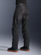 Alpinestars C-1 Air Pants, Urban Motorcycle Pants, Black, rear view showing large tech mesh panels on the back of the legs for ventilation, clean styling for city riding, worn with casual black sneakers.