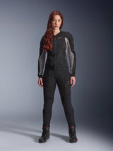 Alpinestars Stella Troop-Air Pants, Women's motorcycle riding pants in black, features mesh panels and zippered pockets, styled with a matching black and grey mesh jacket with pink accents and black riding boots, complete urban motorcycling outfit.